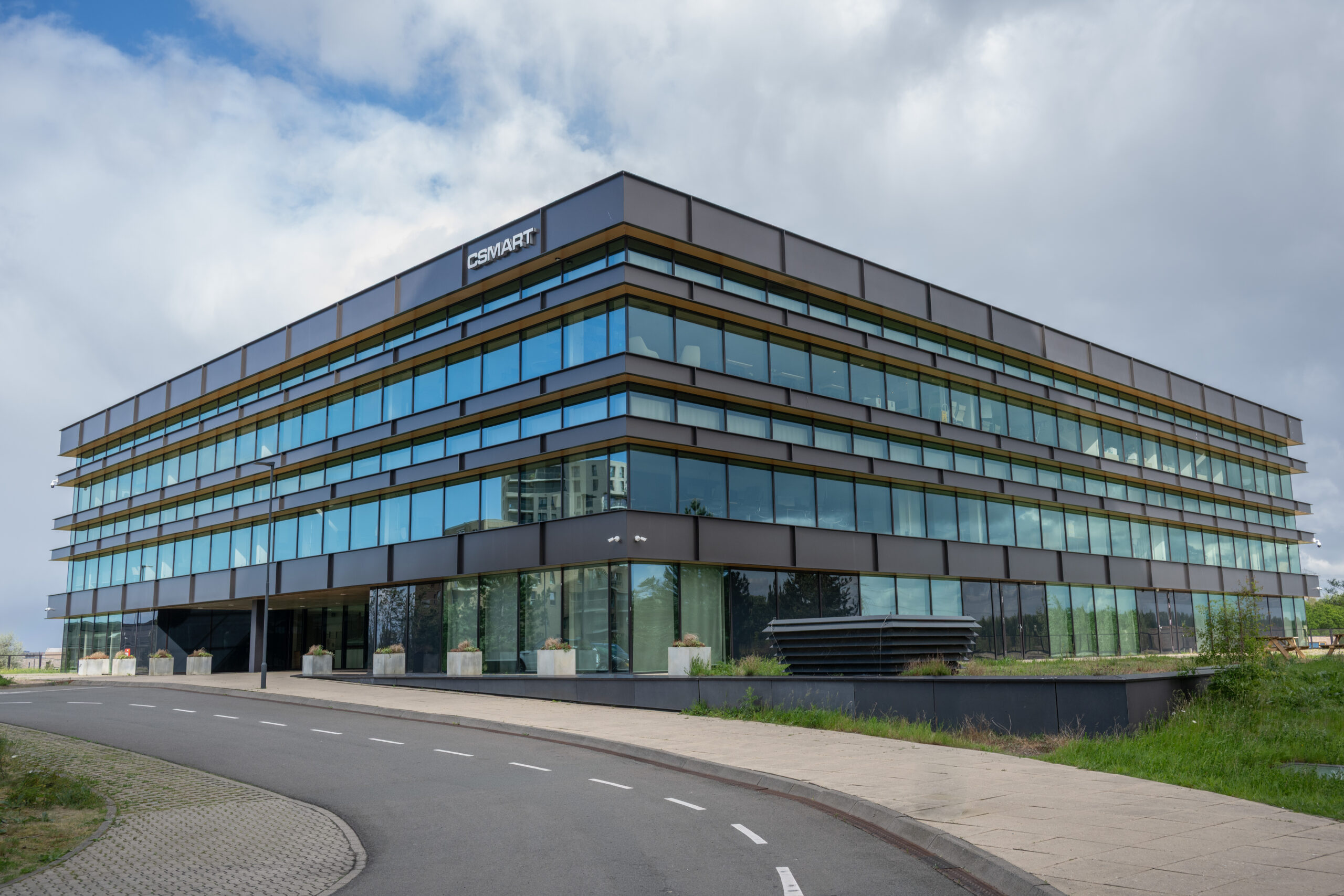 Exterior of the CSMART building under an overcast sky